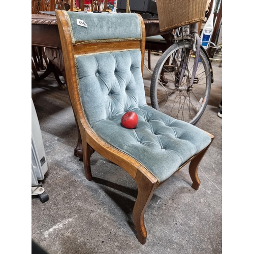 654 - A beautiful Victorian nursing / occasional chair with vintage upholstery and leg repair. Features st... 