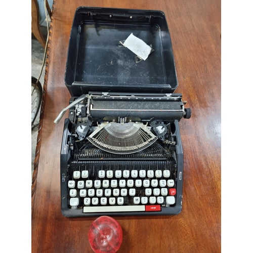 656 - A vintage Korean made typewriter model no. 10234554. with case. Its rare but missing a key or two