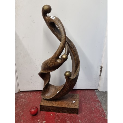 188 - Star Lot : A stunningly very large heavy bronzed toned abstract entwined figure sat on a rectangular... 