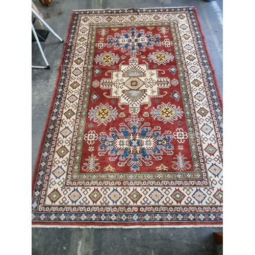 649 - Star Lot: An absolutely stunning large Kazakh hand knotted wool rug / carpet. With classic geometric... 