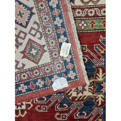 649 - Star Lot: An absolutely stunning large Kazakh hand knotted wool rug / carpet. With classic geometric... 