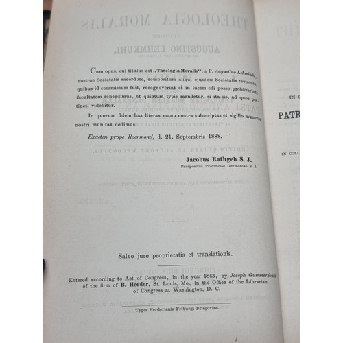 718 - Two antique hardback books titled 'Theologia Moralis' Vol. I and II by  Augustino Lehmkuhl. Dating t... 