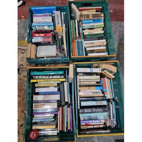 788 - A huge collection of interesting books covering an array of different genres. In 4 large bakers tray... 