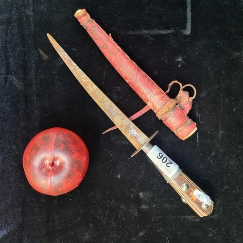 206 - A vintage dagger featuring a carved wooden handle with wire detailing. Accompanied by a red leather ... 