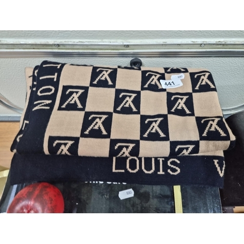 441 - A large  Louis Vuitton scarf featuring a monogram design in beige and black.