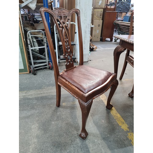 660 - A fabulous mahogany dining table and six Chippendale style chairs with red leather seats. Table and ... 