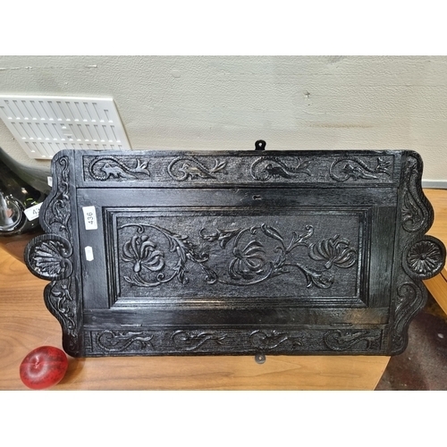 436 - A lovely Victorian corner wall cabinet boasting carved floral motifs. Fitted with two shelves to int... 