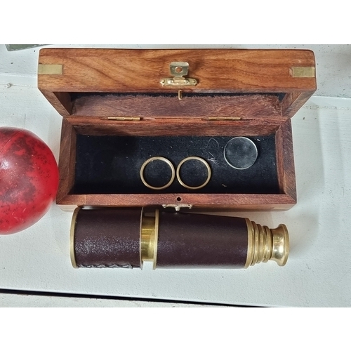 678 - A handsome brass telescope with brown leather detailing. Accompanied by an elegant wooden presentati... 