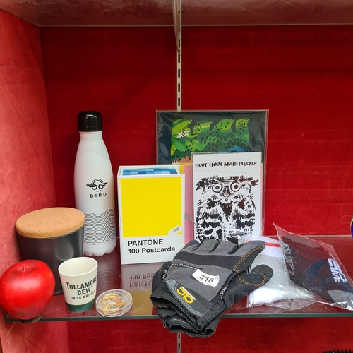 316 - Intriguing Boxed Lot: Including cycling gloves, two pairs of socks, MoPantone postcards, a Bird insu... 