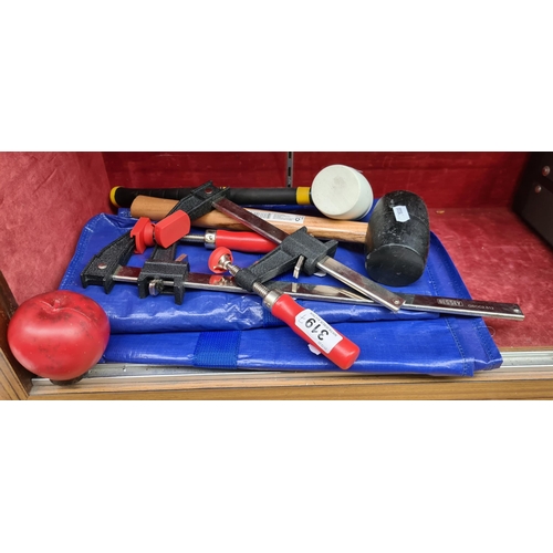 319 - Robust assortment of woodworking tools, including 3 clamps and 2 mallets and two waterproof bags.