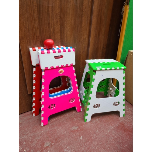 328 - Three folding Vibrant, children's play chairs, whimsically designed in bold pink and green with inte... 