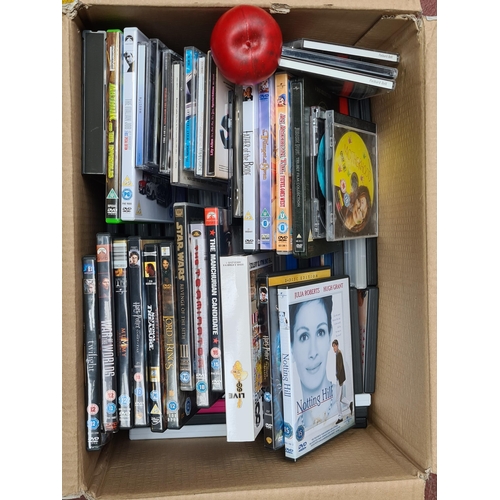 329 - A large box of CDS and DVDS. Inc some classics including Notting Hill 