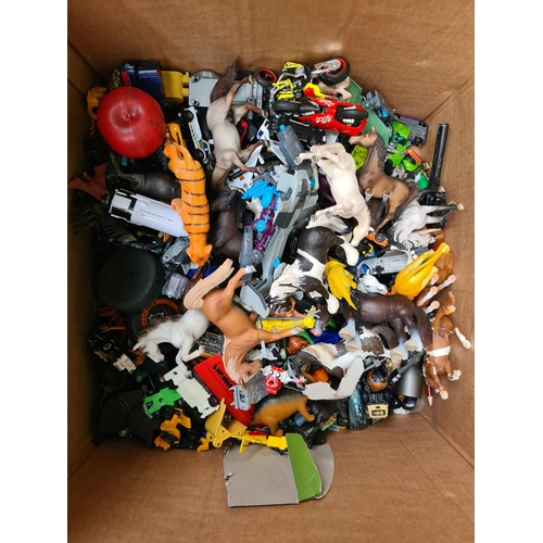 330 - A huge box of vehicles, plastic animals, including horses and motor cycles.