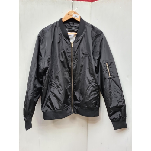 334 - A sleek black bomber jacket made by Bird Rides, featuring a quality zipper and versatile style for u... 