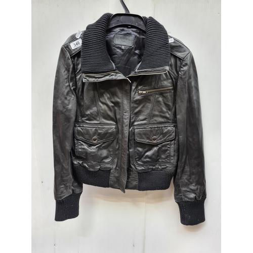 346 - A vintage style Oasis  size 16 black leather jacket with ribbed detailing, boasting zip pockets.