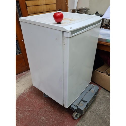 359 - A single door under counter fridge. In good  clean condition. Info brand and model number.