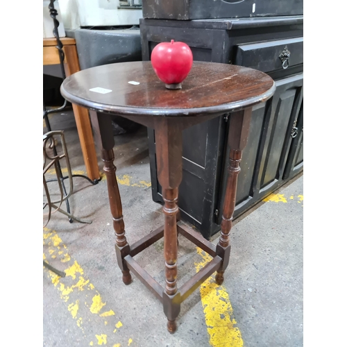 385 - Vintage oak side table, with resolute turned legs, exuding warm, nostalgic charm.