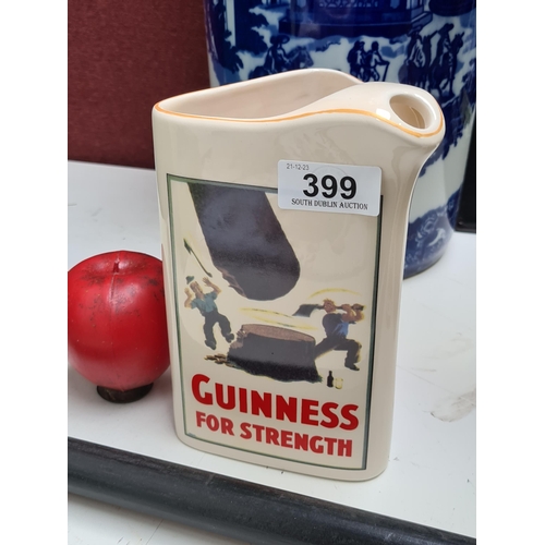 399 - Vintage Guinness ceramic pitcher, boasting iconic advertisement imagery, ideal for collectors.