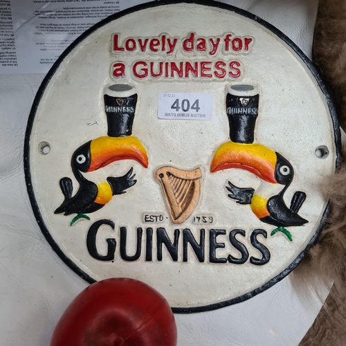 404 - A heavy cast metal Guinness advertising sign, featuring iconic toucans and classic branding - a nost... 