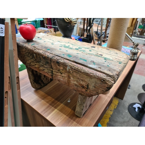 417 - Rustic, reclaimed timber bench, exuding character with its weathered surface and rich patina, an emb... 