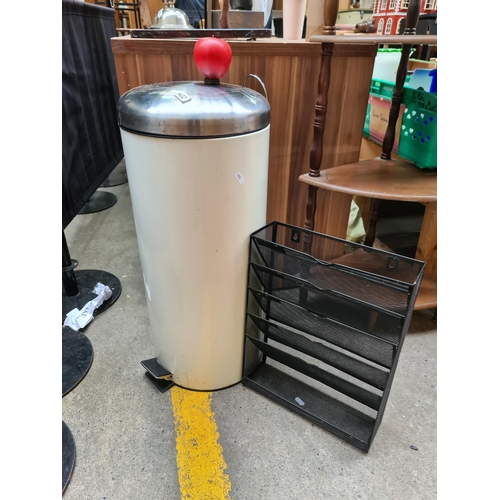 422 - Robust tall foot pedal trash can, complemented by a functional modern black wire office tray.