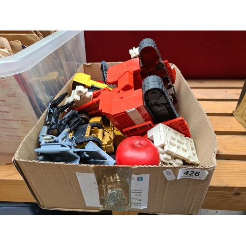 426 - A large box of vintage toys and vehicles.