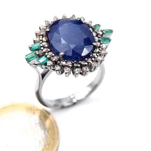 506 - Star Lot : A most attractive art deco style sapphire ring set with emerald and diamond sunburst surr... 