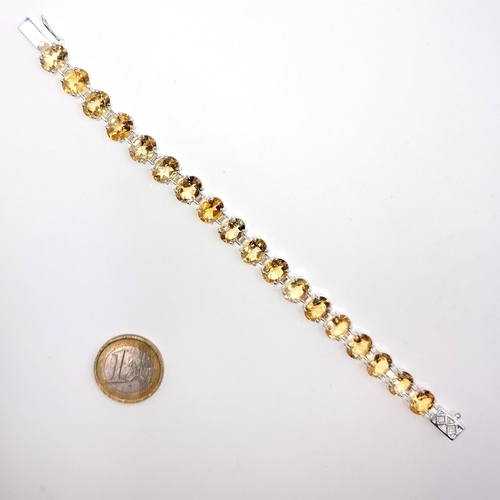 517 - A most attractive citrine stone line bracelet, consisting of 18 beautifully matched bright gemstones... 