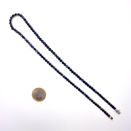 524 - Star Lot : A very nice example of a long sapphire stone necklace set in sterling silver, length of n... 