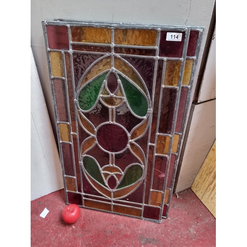 114 - Two mesmerising pieces of stained glass, featuring an Art Nouveau style organic motif to centre in s... 