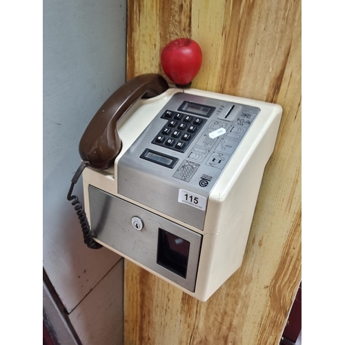 115 - A super retro Telecom Eireann pay phone, attached to mounting board.