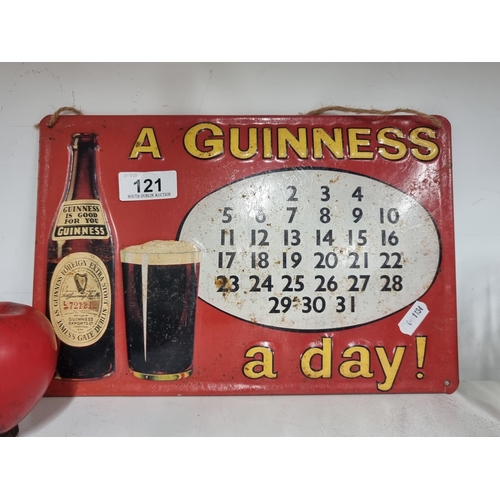 121 - Star Lot : A rare original Guinness A Day metal calendar pub sign.