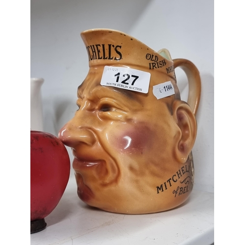 127 - A rare 1930s Mitchell’s & Co Belfast Irish whisky character jug.