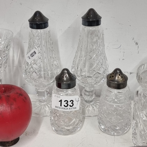 133 - Four fabulous pieces of Waterford Crystal comprising of two salt and pepper shakers.