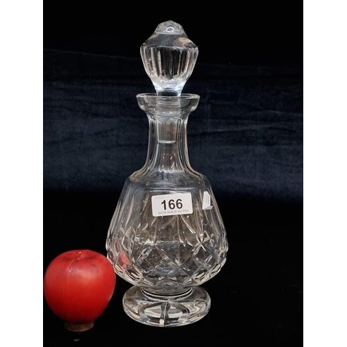 166 - A beautiful Waterford Crystal decanter in the Lismore pattern. With a barely visible tiny loss to ri... 