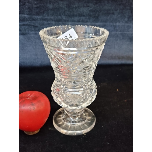 184 - A striking Waterford Crystal pedestal vase with a rich design.