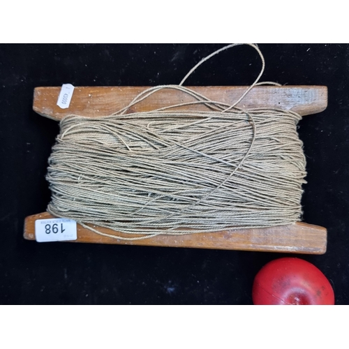 198 - A vintage roll of twine string on a wooden frame. You can do a lot with old string.