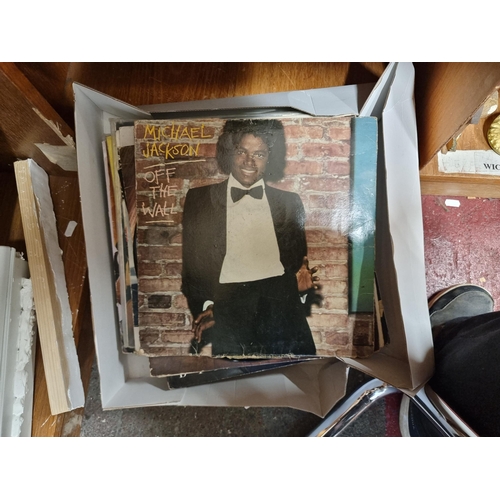 210 - A collection of approx. 25 LP vinyl records including Michael Jackson, Kate Bush and Sade.