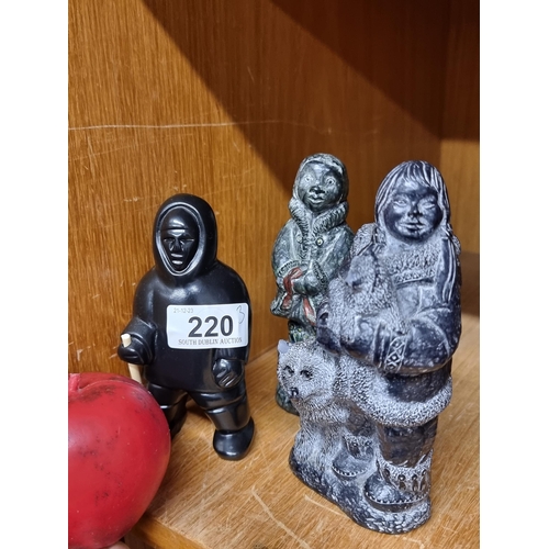 220 - A trio of charming of Eskimo figures including two from The Wolf Sculptures.