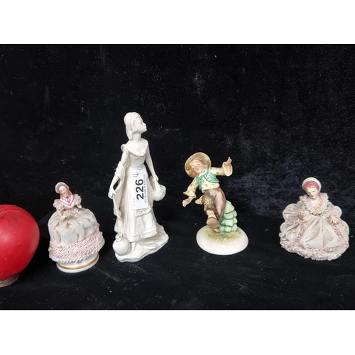 226 - Four beautiful delicate Irish Dresden figurines. Slight losses.