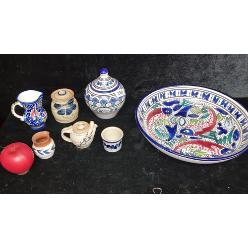 250 - A beautiful collection of seven hand painted pieces of ceramics including a large abstract serving b... 