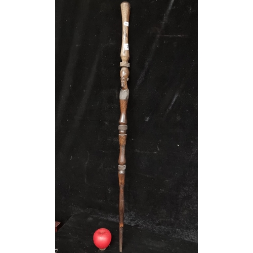 251 - A wonderful African tribal face cane. Hand carved out of heavy ebony wood. The tribal cane has a rou... 