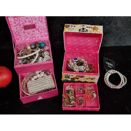 259 - Two boxes full of costume jewelry including watches, bracelets and rings.