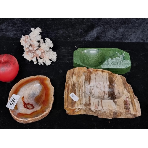 265 - Four items including marble,  verdite and agate ashtrays and a fascinating coral segment.