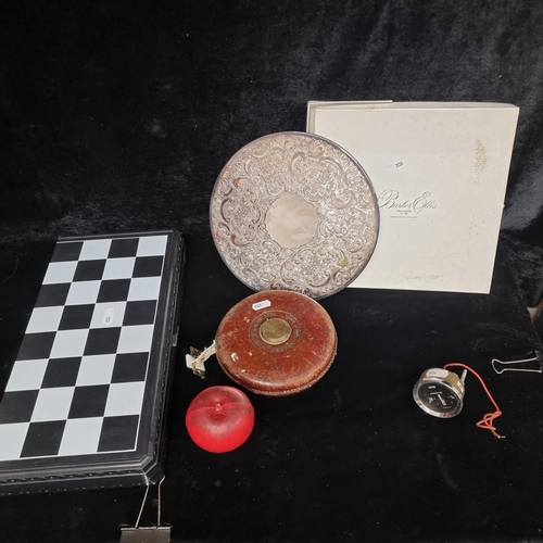 289 - Four items including a vintage measuring tape, a Smiths ammeter, a Barker Ellis Silversmiths placema... 