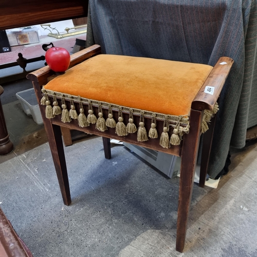 464 - A delightful early 20th century piano stool with square tapered legs and hinged seat that lifts to r... 