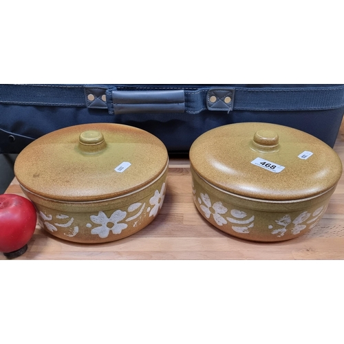 468 - Two mid century lidded vegetable serving terrines with white glazed flowers.