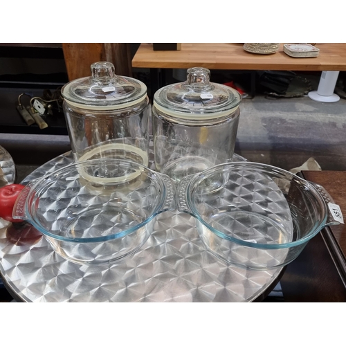 551 - Two Pyrex Excellence round glass dishes along with two large biscuit / sweet jars.