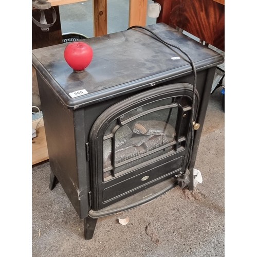 565 - A good size electric indoor heater in the from of a fireplace made by Club. H61cm Logs light up nice... 