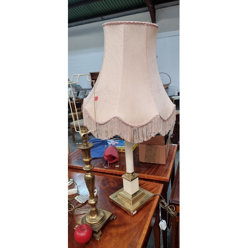 569 - Two elegant vintage table lamps with brass bases including one featuring a pillar stem.